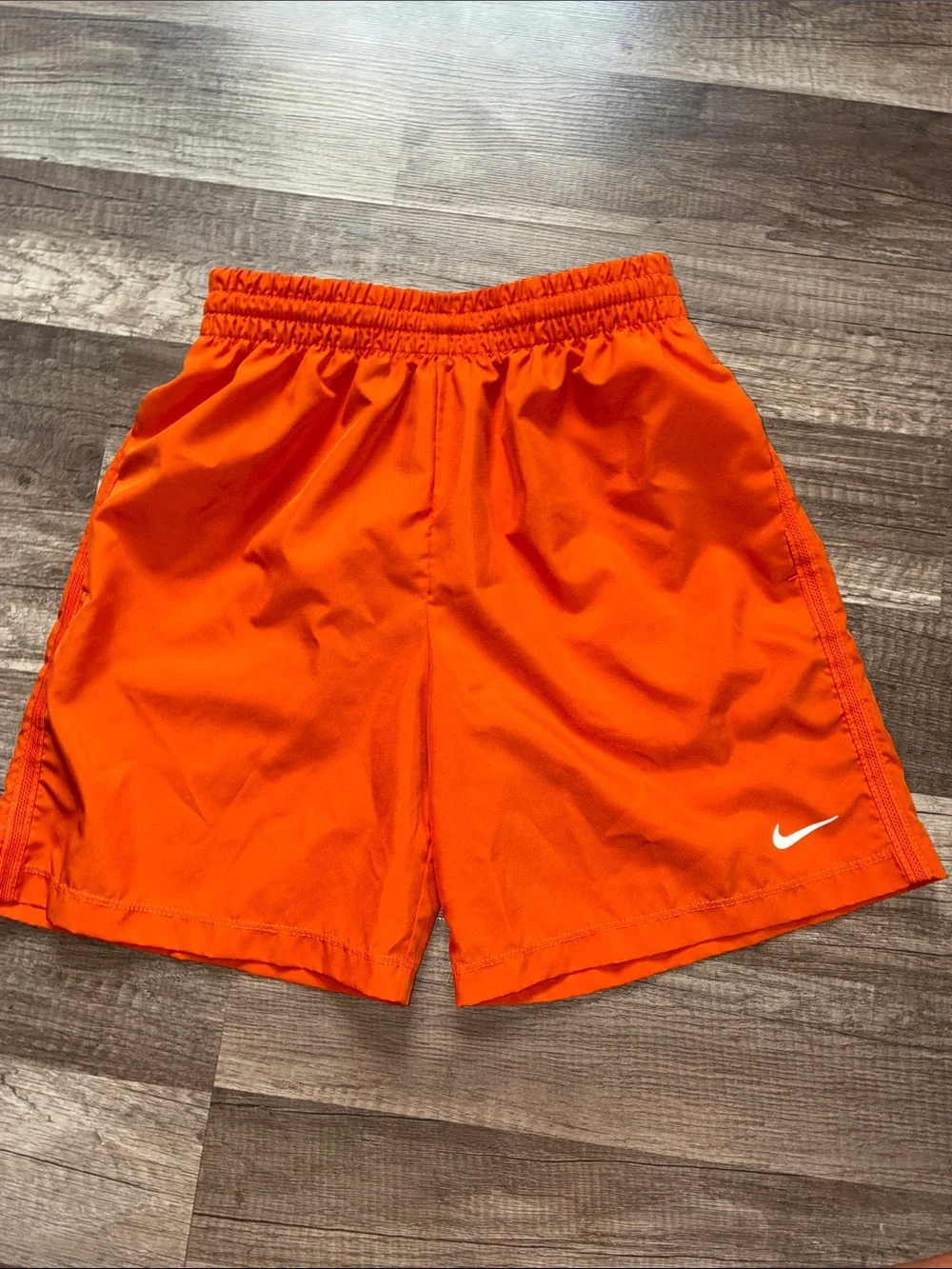Boys Nike Orange Shorts with White Swoosh